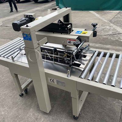 Máquina de embalaje automática de 220V / 50HZ 12mm caja de cartón sellador adhesivo de cinta adhesiva